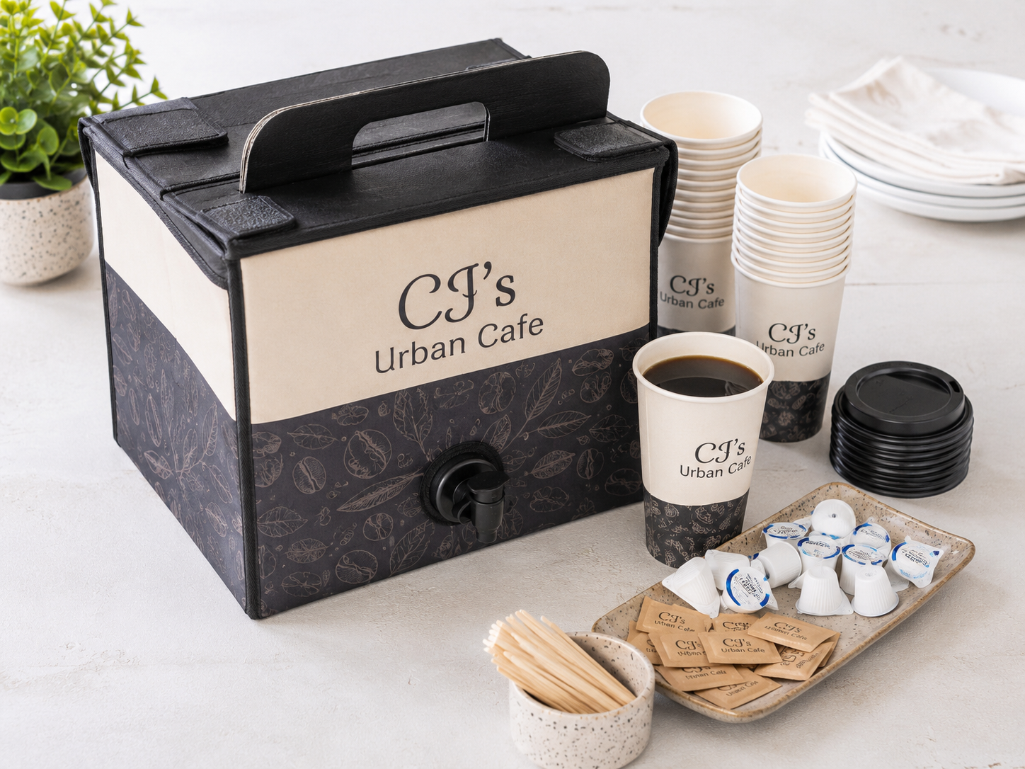CJ's Urban Cafe coffee traveler box — branded dispenser with cups, cream, and sugar