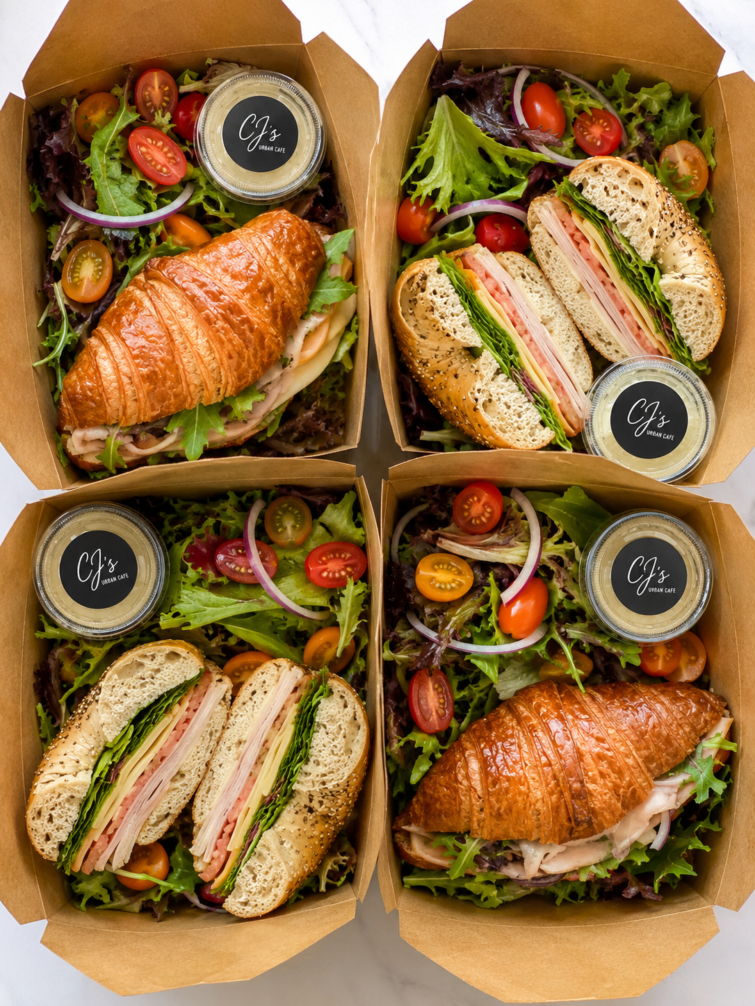 CJ's Urban Cafe classic sandwich box — croissant or multigrain with salad, CJ's branded packaging