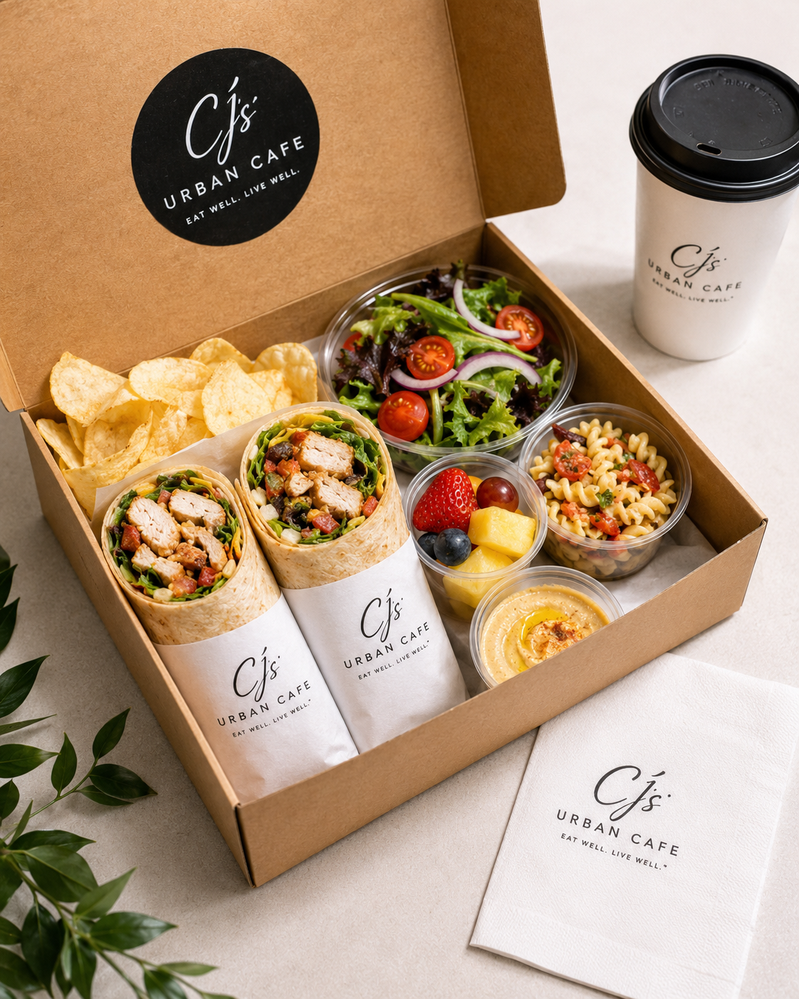 CJ's Urban Cafe wrap box — assorted wraps with chips and salsa